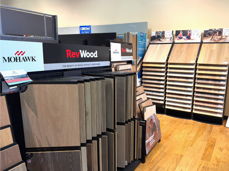 Wood-look laminate flooring colors and styles in Austin showroom - 800x600