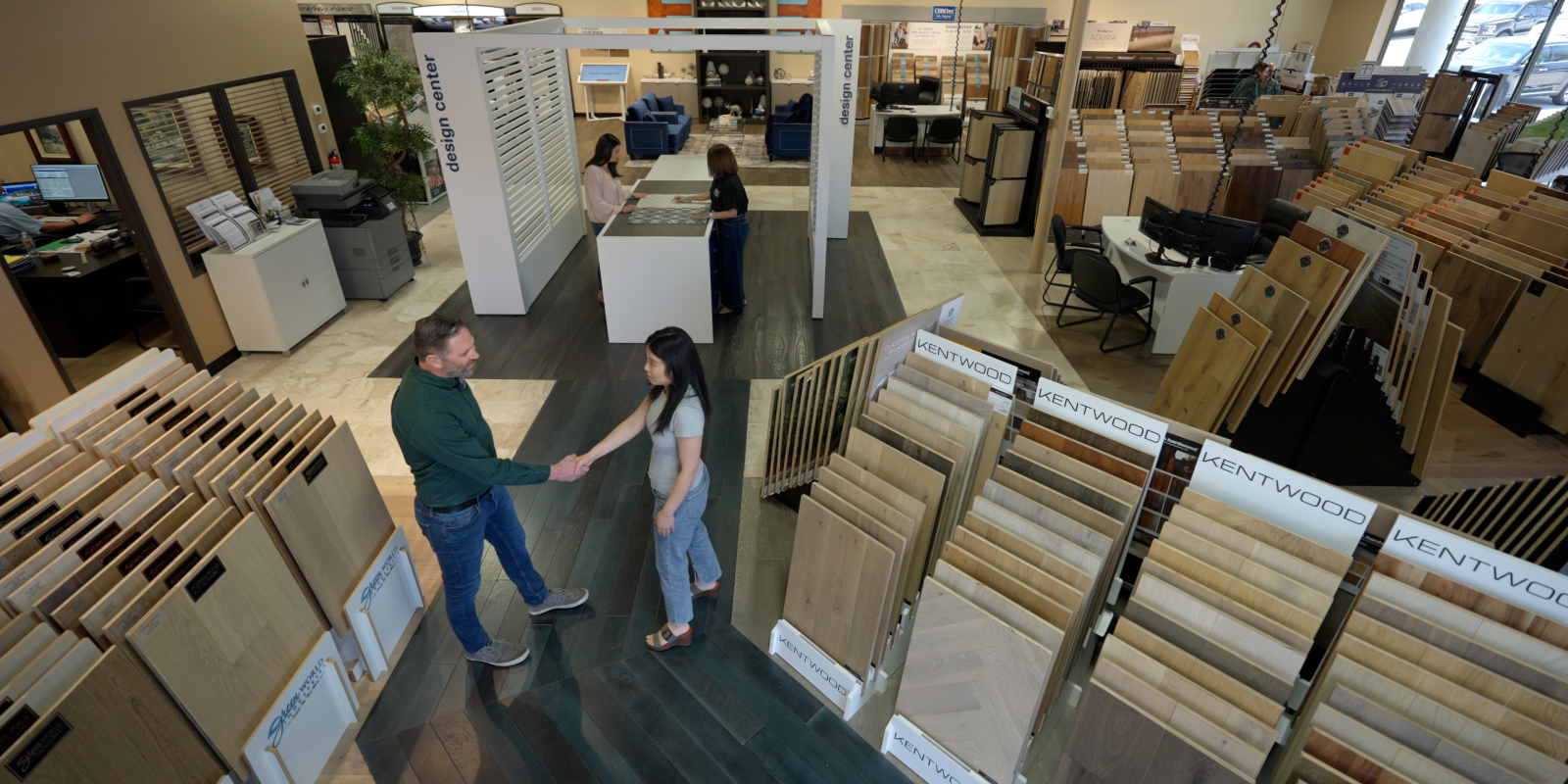 Landers Premier Flooring Team Members With Clients